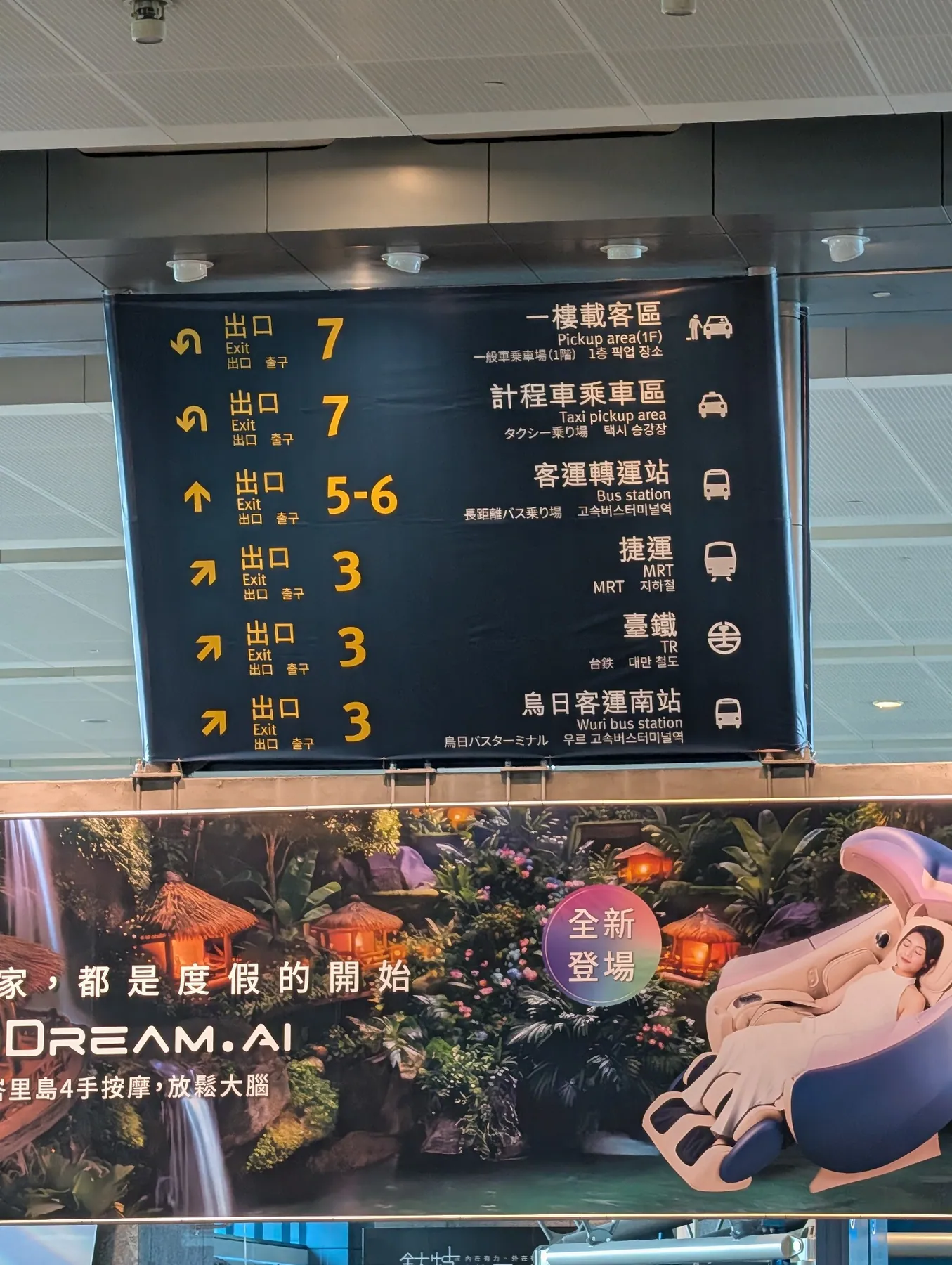 Overhead board showing exits 3, 5–6 and 7 with transport symbols